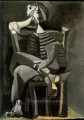 男が座って編み物ストライプ 1939 年キュビズム パブロ・ピカソ